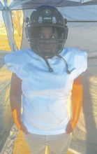 Artavion Gibson shows off his new gear after being fitted last week. DEBRA HOPKINS