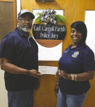 Kendall Thompson (left), East Carroll Police Jury president, and Ronata Johnson, secretary-treasurer, accept a check for computers. COURTESY PHOTO