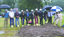 Elected officials and community members braved soggy conditions to attend (from left) Alderman Jason Condrey, Mayor Bobby Amacker, Police Juror Roger Clement, Police Jury Vice President Kofi Darden, Police Jury President Kendall Thompson, Rep. C. Travis Johnson, Clerk of Court Rene Williams, Sheriff Wydette Williams, Sen. Katrina Jackson-Andrews, Deputy Bill Hopkins, School Board Vice President Jackie Folks, and School Board President Wanda Jackson. COURTESY PHOTO
