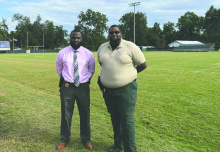 Tystin White and Greg Campbell on the football field at General Trass where the Bayou League will conduct its peewee football program. DEBRA HOPKINS