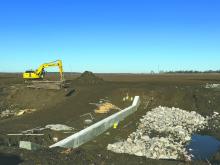 Repairs continue on the weir on Tensas Bayou.