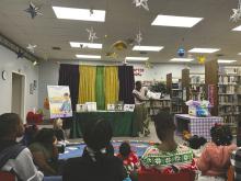 Frededreia (DeDe) Willis Dunham reads to patrons of the East Carroll Parish Library during a celebration on the release of her book.