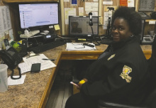 East Carroll dispatcher, Pam Carter, sits in front of the 12-year-old outdated 911 equipment slated to be replaced in the next few weeks. DEBRA HOPKINS