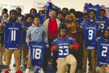 Before last week's game, members of the Panther team picked a member of the staff and presented them with a replica of their jerseys, which the teacher/staff members wore to school the next day. COURTESY PHOTO