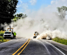 COURTESY PHOTO A gravel spill last week on Highway 65 South between the Sondheimer Post Office and the saw mill created a roaring wall of dust and impeded traffic in both directions. The spill was cleaned up promptly and traffic began flowing within an hour.