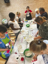 Pictured is Markaye Russell, LSU AgCenter nutrition and community health agent for Ouachita/Union parishes, demonstrating making homemade bread with a group of adults at Union Parish Library.