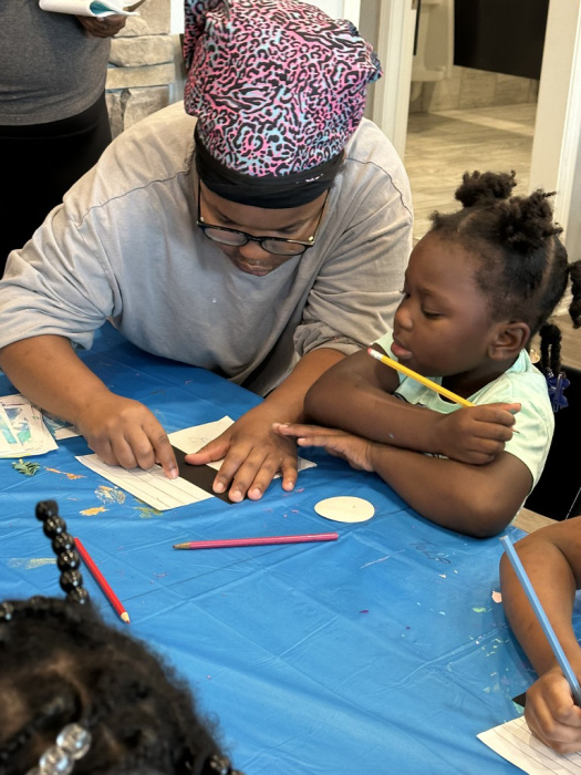 The younger children participated, with a little help