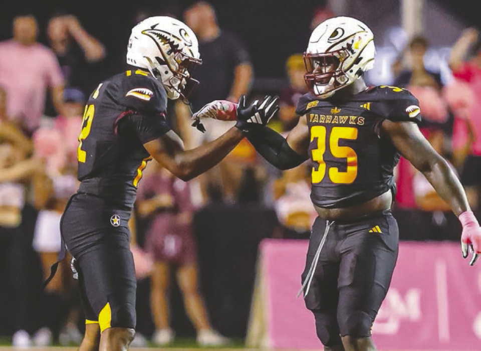 Wydett Williams Jr. celebrates with teammate, Carl Glass Jr., who also has ties to Lake Providence
