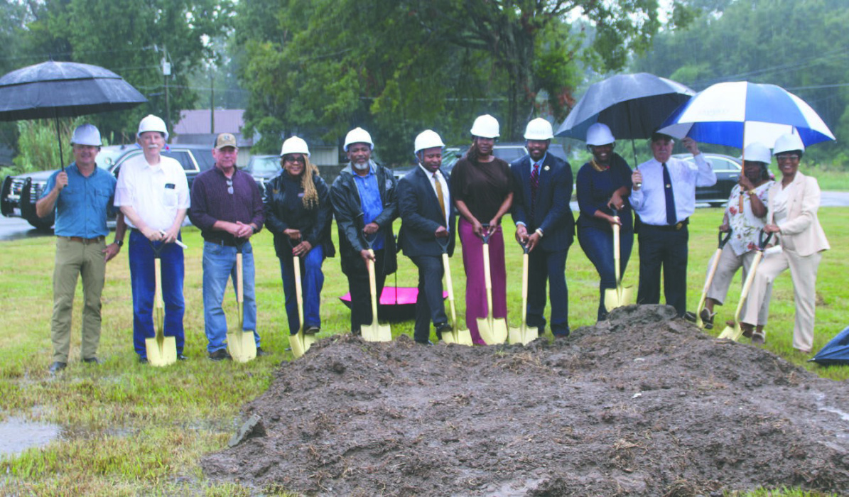 Elected officials and community members braved soggy conditions to attend (from left) Alderman Jason Condrey, Mayor Bobby Amacker, Police Juror Roger Clement, Police Jury Vice President Kofi Darden, Police Jury President Kendall Thompson, Rep. C. Travis Johnson, Clerk of Court Rene Williams, Sheriff Wydette Williams, Sen. Katrina Jackson-Andrews, Deputy Bill Hopkins, School Board Vice President Jackie Folks, and School Board President Wanda Jackson. COURTESY PHOTO