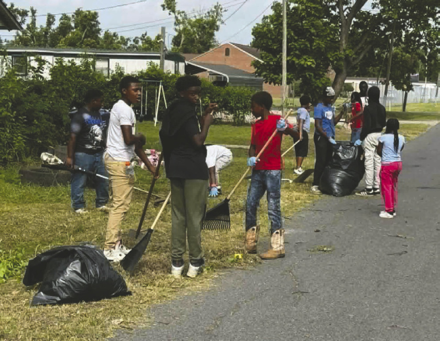 DEBRA HOPKINS Young people cleaning up around Lake Providence.