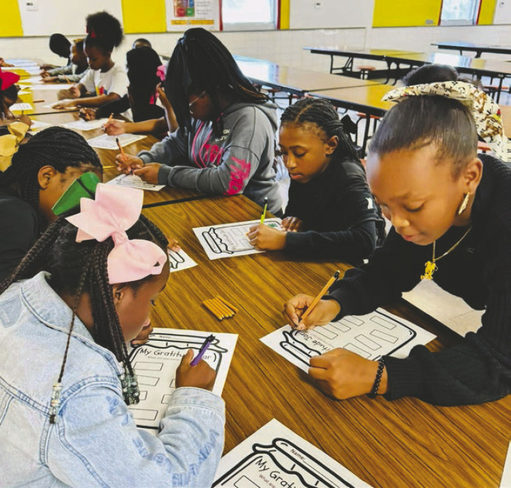 4-Hers writing what they're grateful for