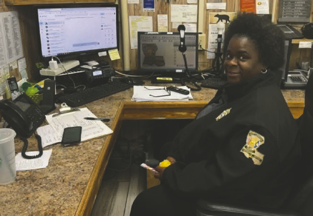 East Carroll dispatcher, Pam Carter, sits in front of the 12-year-old outdated 911 equipment slated to be replaced in the next few weeks. DEBRA HOPKINS