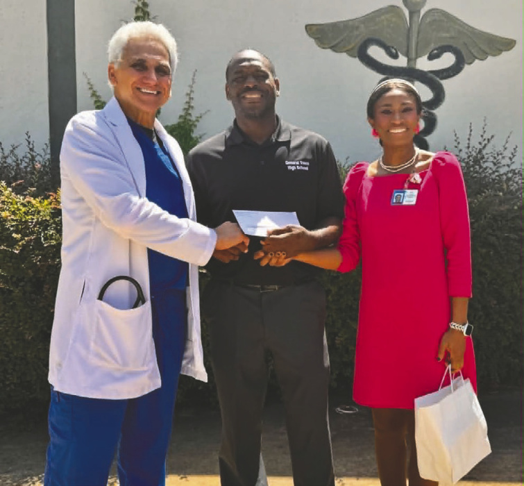 DEBRA HOPKINS Dr. George Fahkre, a doctor with the West Carroll Health System, presented a monetary donation to the General Trass High School football team to support their upcoming season. His contribution reflects a continued commitment to uplifting youth programs and investing in student-athletes in our community. Pictured (from left) Fakhre, GTHS Coach Toriano Wells, and Dr. Rosemary Koeppel, pediatrician.