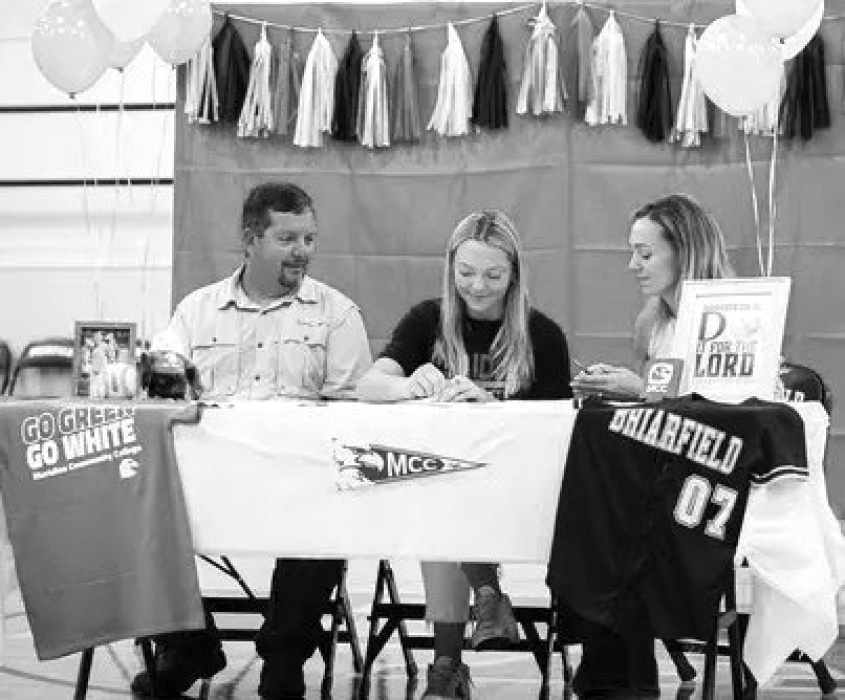 Aubree Jones signing to play softball for Meridian Community College. She is pictured with her parents, Matthew and Felecia Jones. TAYLOR HOWARD
