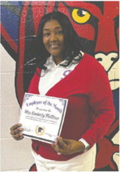 General Trass High School recently recognized its employee and students of the month for November. Pictured (above, from left) are Assistant Principal Toriano Wells, Derzavien Stewart, Stacy Bolden, KaZarca Sanders, Malyk Brown, Cantrice Lewis, and Principal Rickey Taylor. Pictured (at right) is GTHS employee honored for November, Kimberly Matthews, administrative assistant.