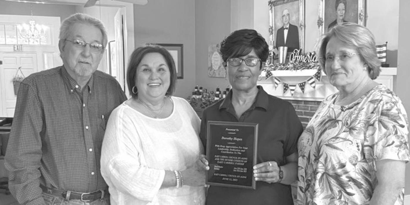 From left, outgoing president of the East Carroll Council on Aging, Van Hicks Jr., along with Evelyn LeBeau, executive director, present an appreciation plaque to Dorothy Hopes on the completion of her second year on board of directors. At right is Joyce Thompson, executive director of CENLA Council on Aging. DEBRA HOPKINS
