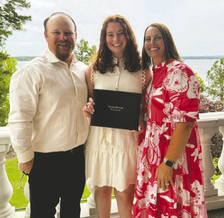 Abigail Payne with parents Zach and Claire Payne