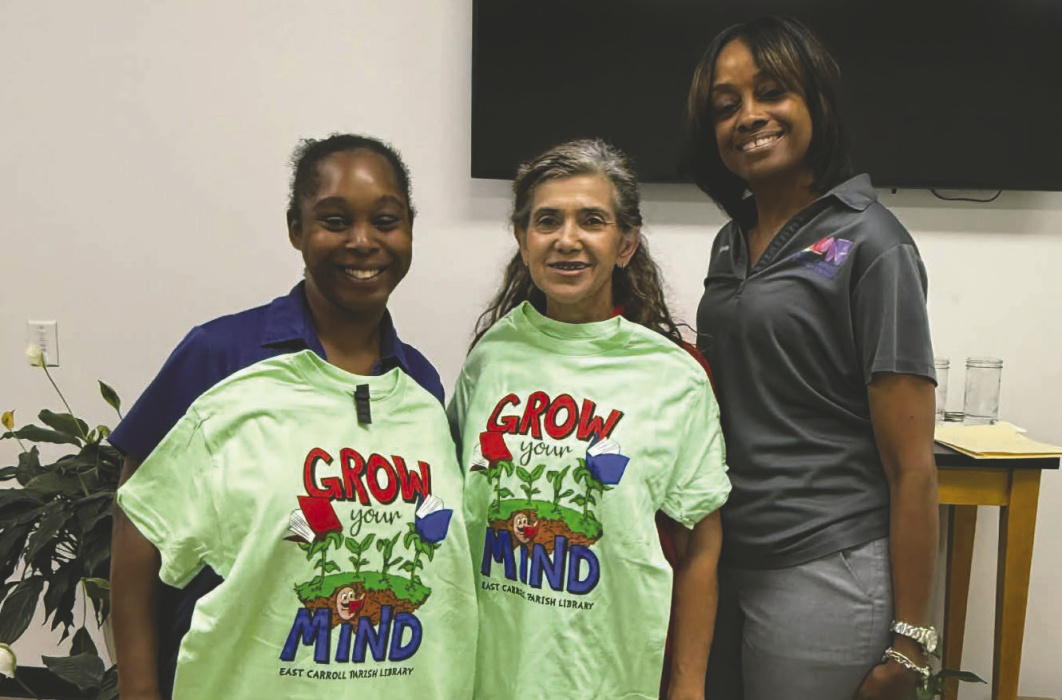 The Friends of the East Carroll Parish Library will begin selling summer t-shirts next week at the library. Children's sizes range from x-small (2-4), small (6-8), medium (10-12), and large (14-16), and adult sizes are small, medium large, x-large, 2x-large, 3x-large, 4x-large, and 5x-large. Shirts are $5.75 each for all sizes except the larger adult sizes which vary. Dominique Jones, Bobbie Prine, and Krishanda Sanders show off the new shirts ready for everyone next week at the library!
