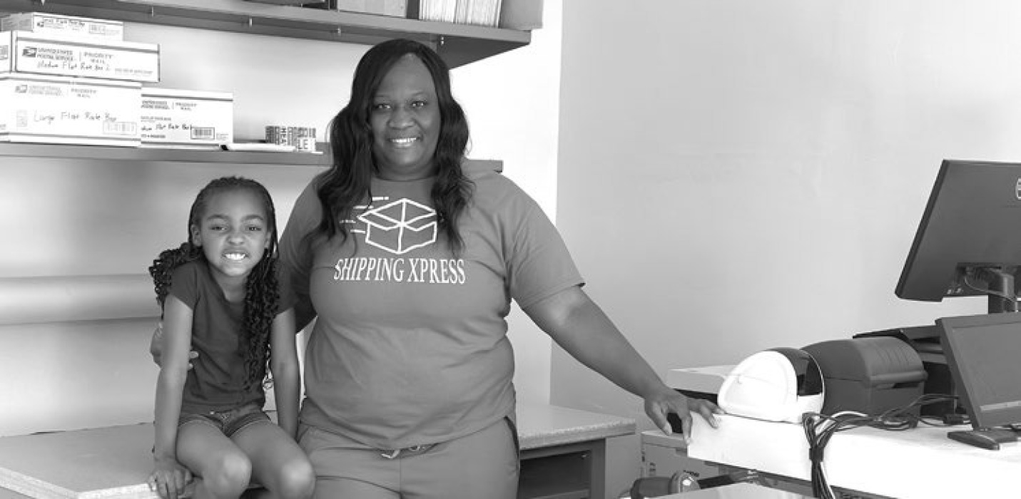 Myeisha Gilmore with daughter, PopTart, at Shipping Xpress on Lake Street CASSIE CONDREY