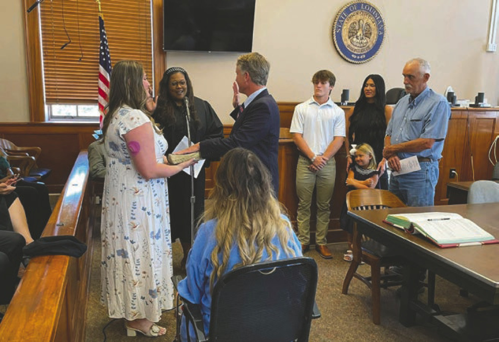 Above, Moberley sworn in; at right, Paxton retires