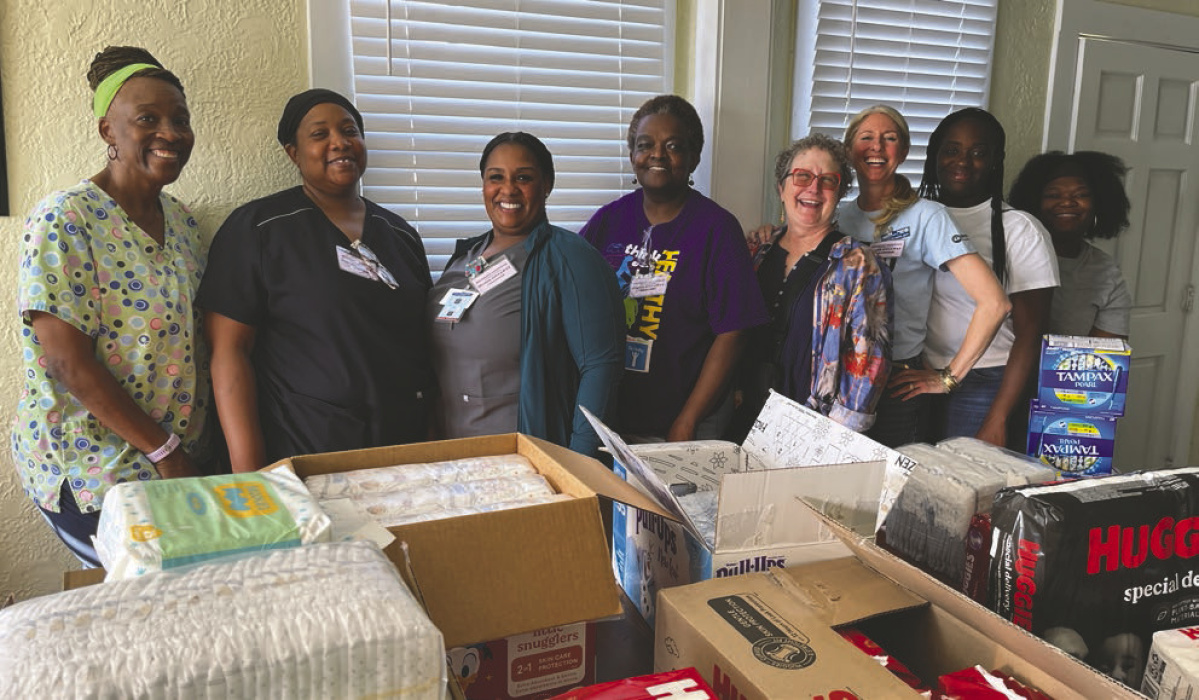 Volunteers at last week's Necessary Essentials diaper giveaway are (from left) Wanda Manning, Dora Smith, LaKetha Lane, Madlyn Matthews, Sara Beth Howard, Wendy Napoli, Brittany Lyons and Terrice Newson. Not pictured are Kyle Kelley and Meagan Banai. LAURA ARVIN