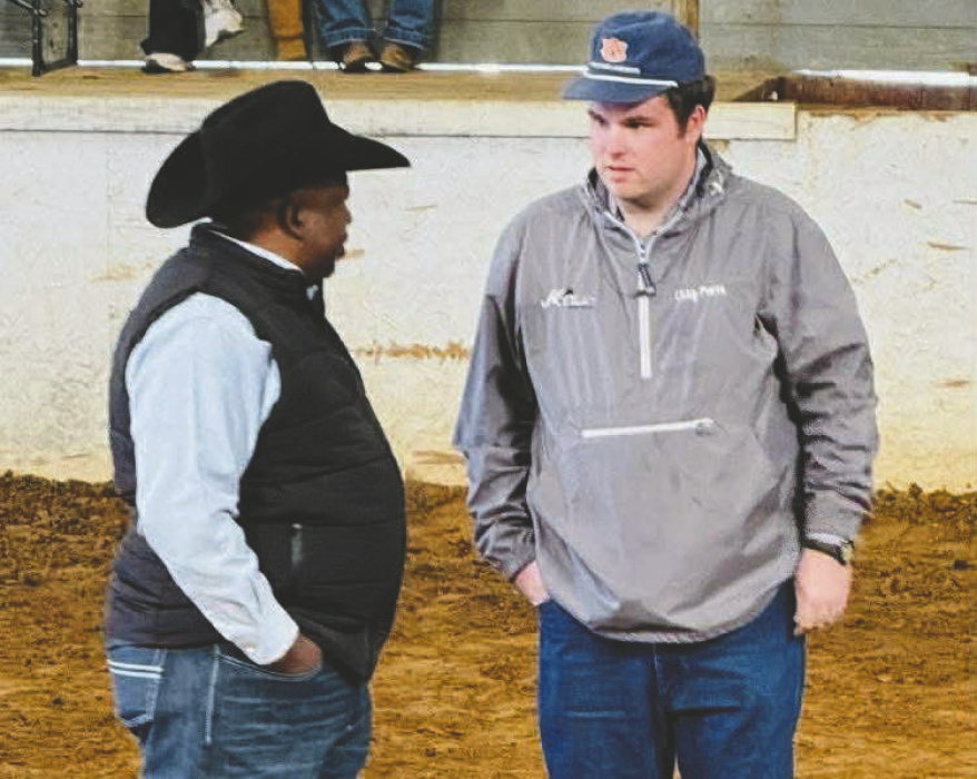 Clay Pierce with official at the livestock show
