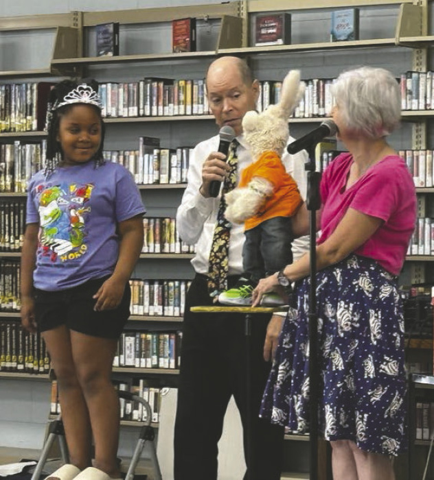 'Princess Penelope' assists Harvey Rabbit and friends at the Summer Reading Program.