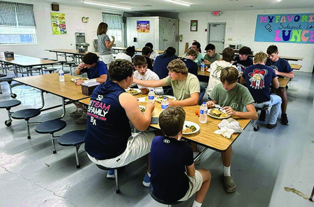 Briarfield football players enjoy a meal