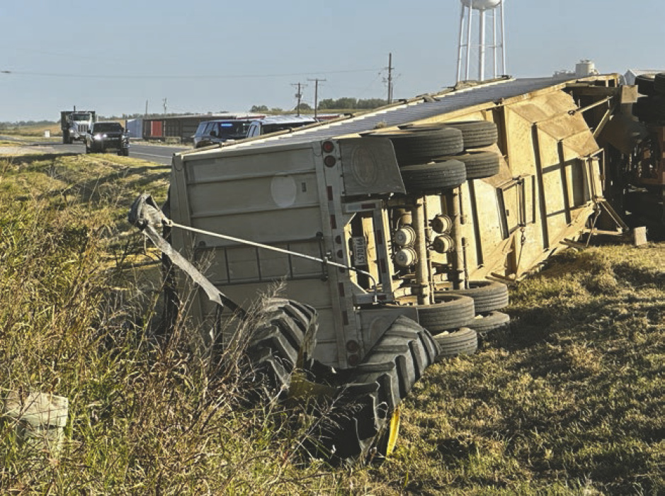 An 18-wheeler filled with grain overturned